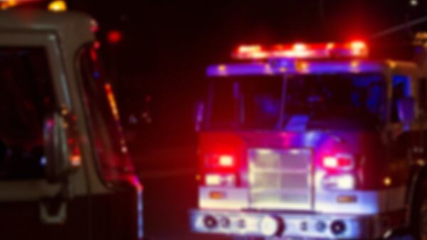 Person found dead in carport after fire in DeKalb County