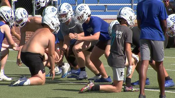 High school football team holds first practice after quarterback badly injured