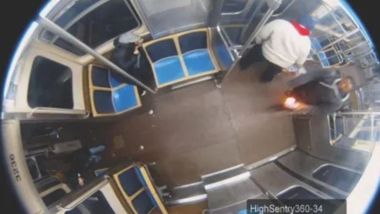 Surveillance video shows a suspect on a Chicago train carrying an ignited plastic bottle.