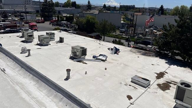 Officials say one person has died after a small plane crashed on the roof of a building in Auburn, Washington