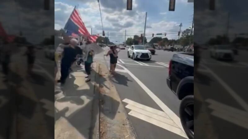 Upside-down American flag at protest leads to scuffle, charges for U.S. veteran, police say