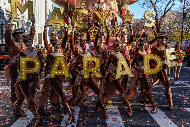 NEW YORK, NEW YORK - NOVEMBER 23: People participate in Macy's annual Thanksgiving Day Parade on November 23, 2023 in New York City. Thousands of people lined the streets to watch the 25 balloons and hundreds of performers march in this parade happening since 1924. (Photo by Stephanie Keith/Getty Images)