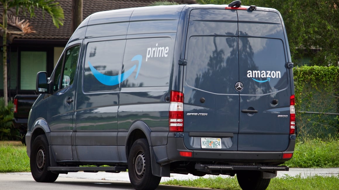 06-09-2019 Miami-Dade county Florida U.S.A. Amazon Prime delivery vehicle stops in residential neighborhood to deliver packages