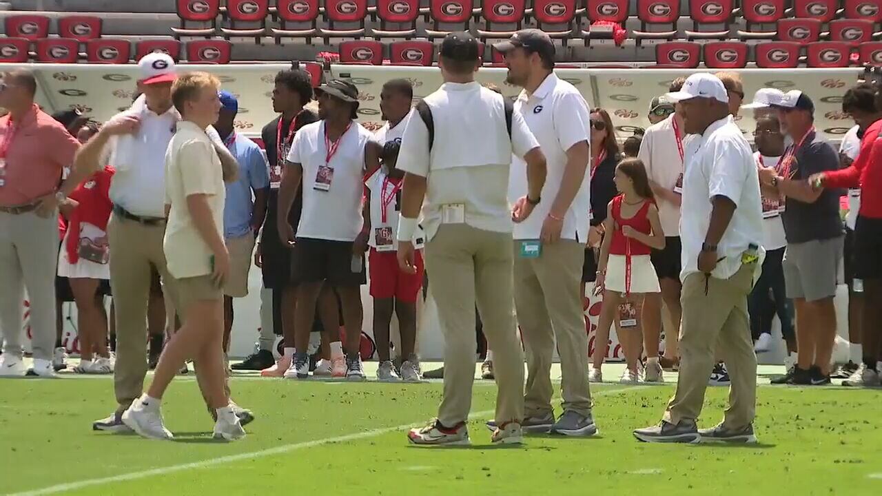 Georgia fans battle triple - digit heat for game day in Athens
