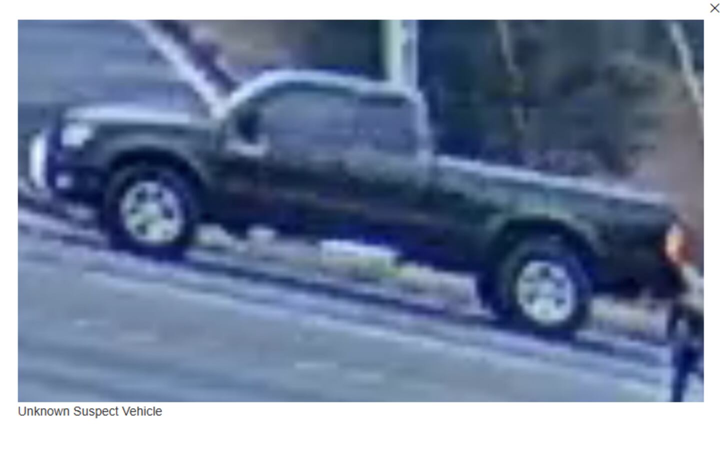 A screenshot from surveillance video shows the stolen Toyota Tacoma as it left the scene of the homicide.