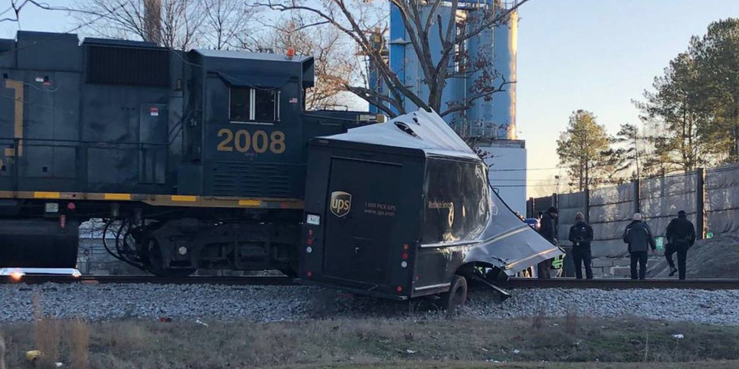 Train vs. UPS truck Crash leaves delivery driver seriously injured