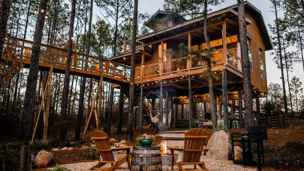 Georgia Airbnb treehouse includes skywalk, outdoor soaking tub, bed swing, koi pond